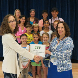 Lindsey giving award to Sandra Reece, Principal, Bradley Hill ES